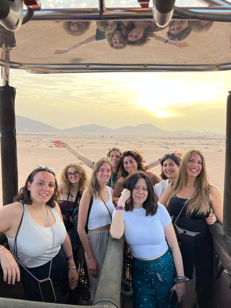happy tourists in minivan